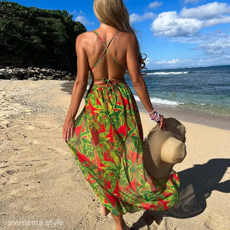 Vibrant red and green tropical print maxi dress, backless design, perfect beach outerwear