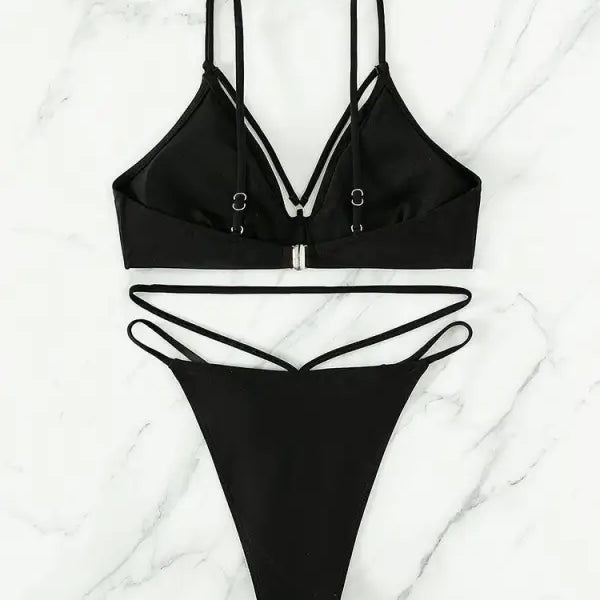 Black two-piece swimsuit featuring a stylish small circle design for summer vacations