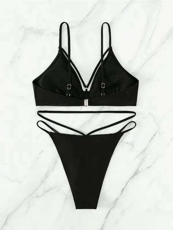 Black two-piece swimsuit featuring a stylish small circle design for summer vacations