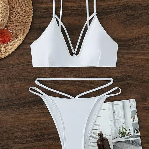 White two-piece swimsuit featuring a stylish small circle design for summer vacations