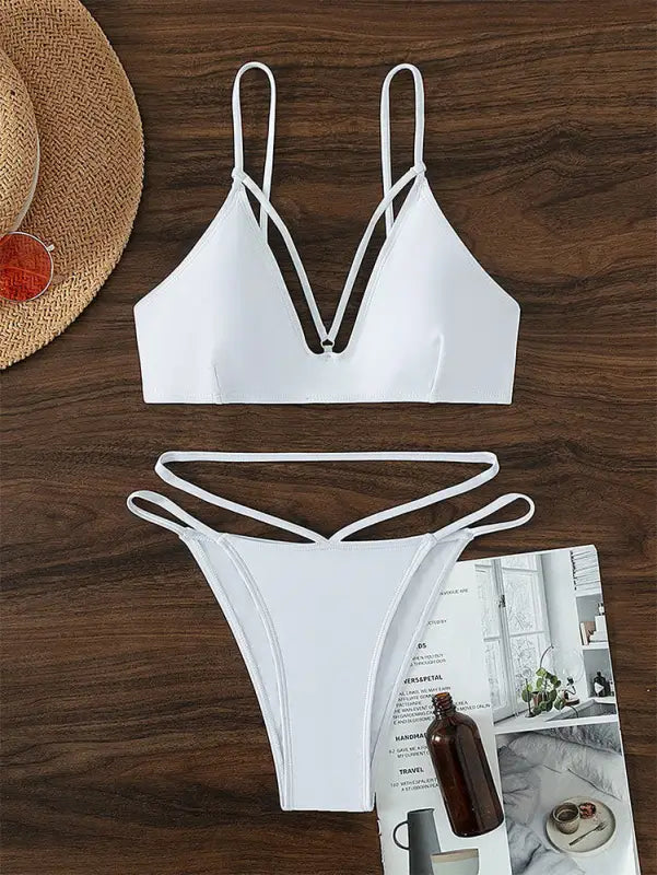 White two-piece swimsuit featuring a stylish small circle design for summer vacations