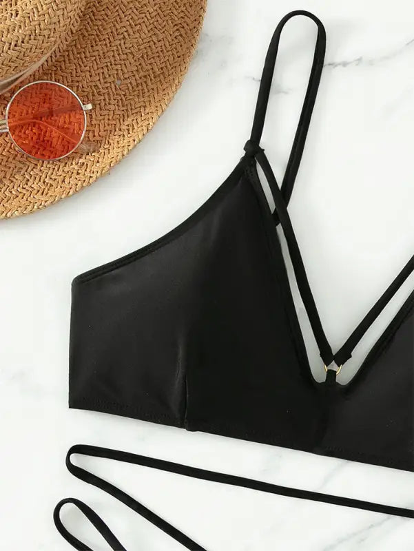 Black bikini top with spaghetti straps from the Boho Small Circle Swimsuit collection