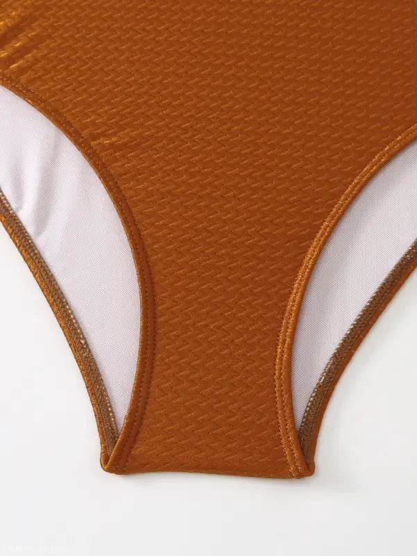 Textured brown bikini bottom paired with the Boho Summer Color Block Jumpsuit