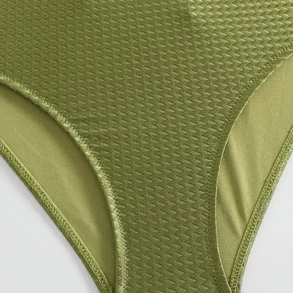 Green textured high-waisted bikini bottom paired with Boho Summer Color Block Jumpsuit