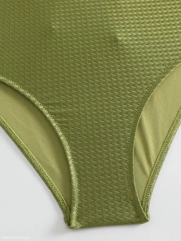 Green textured high-waisted bikini bottom paired with Boho Summer Color Block Jumpsuit