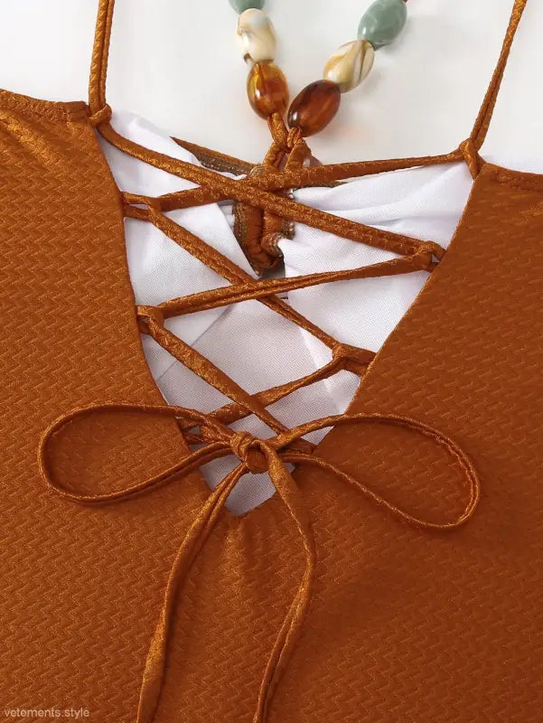 Brown criss-cross swimsuit paired with Boho summer color block jumpsuit in Wine Red