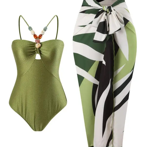 Green swimsuit and patterned sarong from the Boho Summer Color Block Jumpsuit collection