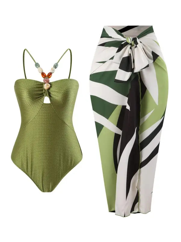 Green swimsuit and patterned sarong from the Boho Summer Color Block Jumpsuit collection
