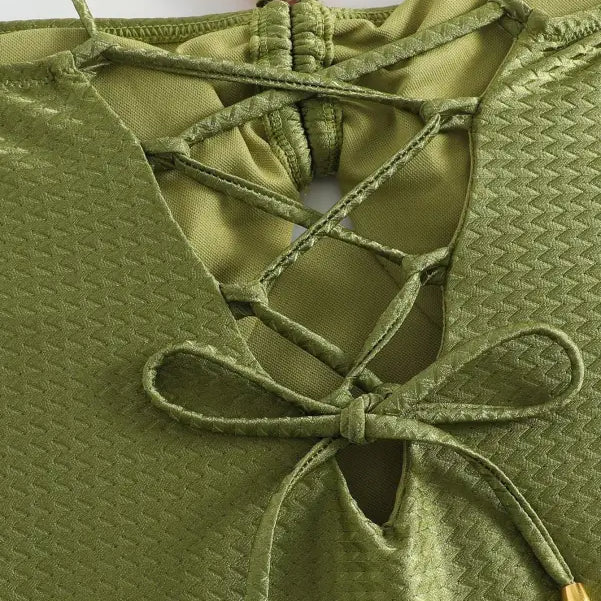 Green jumpsuit featuring a textured top and lace-up detail from the Boho Summer collection