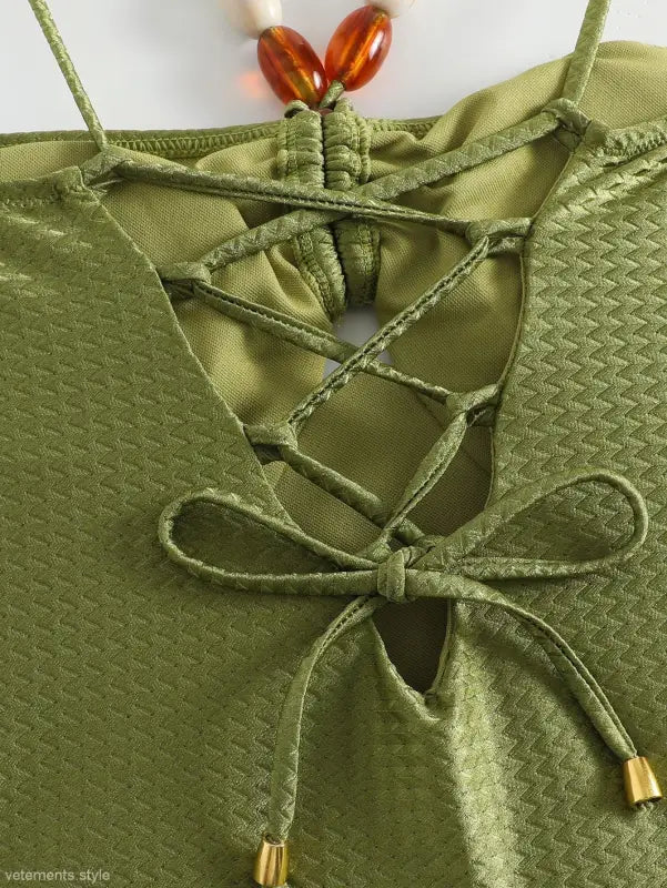 Green jumpsuit featuring a textured top and lace-up detail from the Boho Summer collection