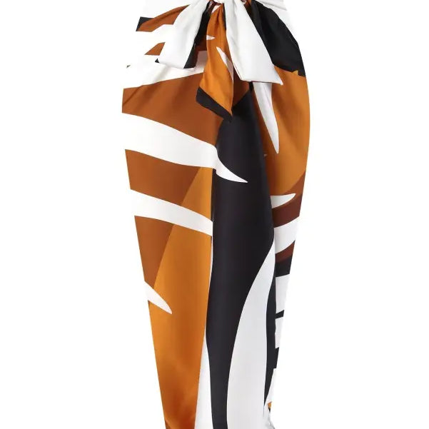 Brown, white, and black patterned sarong paired with a Wine Red Jumpsuit for summer style