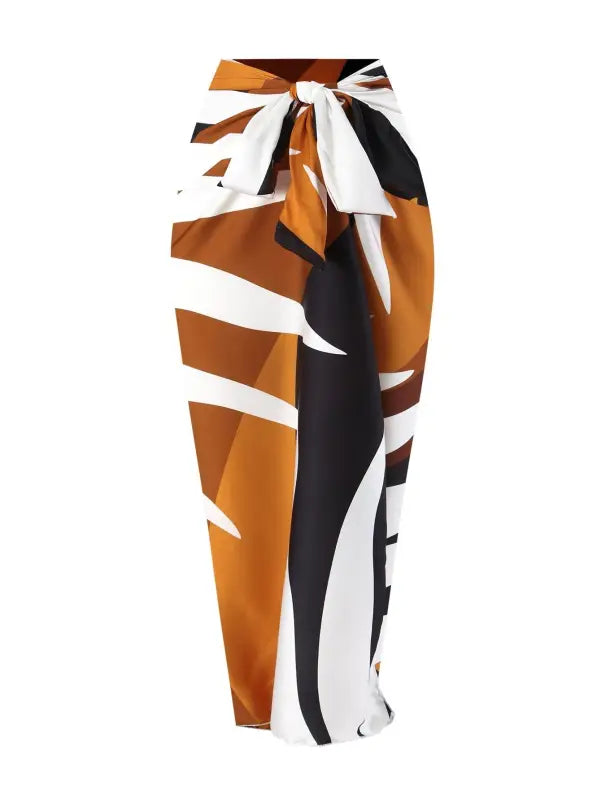 Brown, white, and black patterned sarong paired with a Wine Red Jumpsuit for summer style