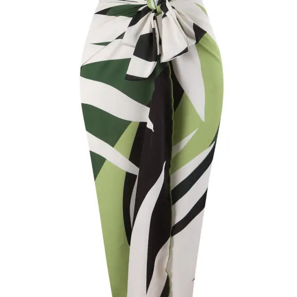 Green, white, and black patterned sarong paired with a Boho Summer Color Block Jumpsuit