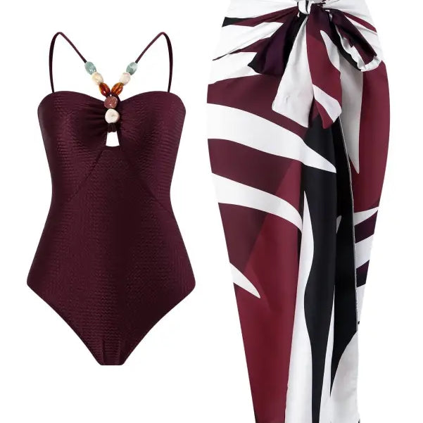 Burgundy swimsuit paired with patterned sarong showcased with Wine Red Jumpsuit