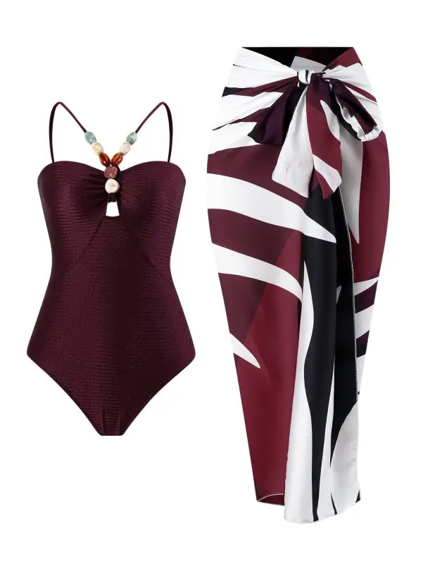 Burgundy swimsuit paired with patterned sarong showcased with Wine Red Jumpsuit