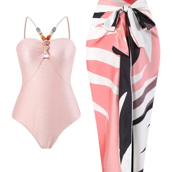 Pink swimsuit and patterned sarong paired with a stylish Wine Red Jumpsuit