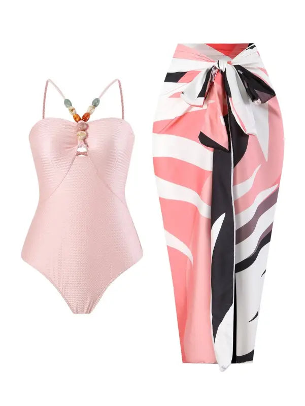 Pink swimsuit and patterned sarong paired with a stylish Wine Red Jumpsuit