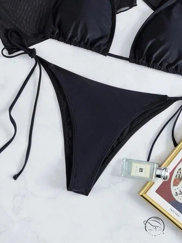 Black string bikini bottom from boho summer bikini set with lace detail