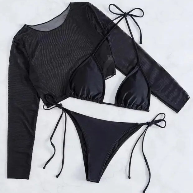 Three-piece black swimsuit set consisting of a long-sleeved top, triangle bikini top, and tie-side bikini bottom.