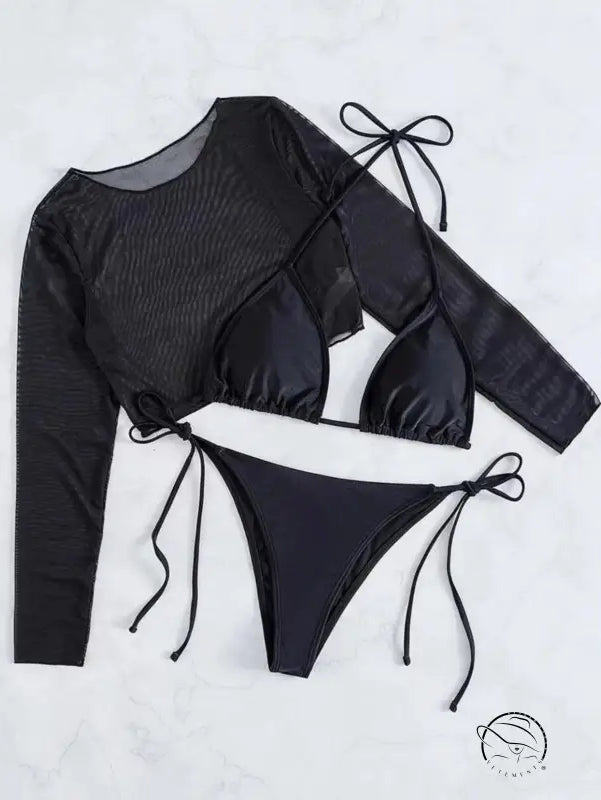 Three-piece black swimsuit set consisting of a long-sleeved top, triangle bikini top, and tie-side bikini bottom.