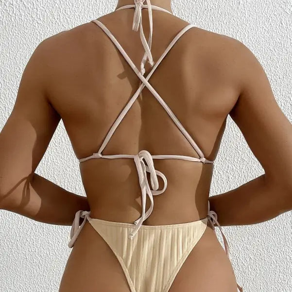 Woman in beige bikini-style one-piece swimsuit from Boho Summers, free shipping