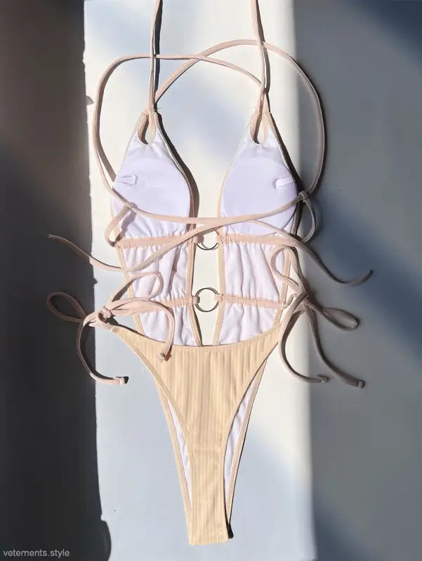 Beige one-piece swimsuit with ring details from Boho Summers, featuring free shipping