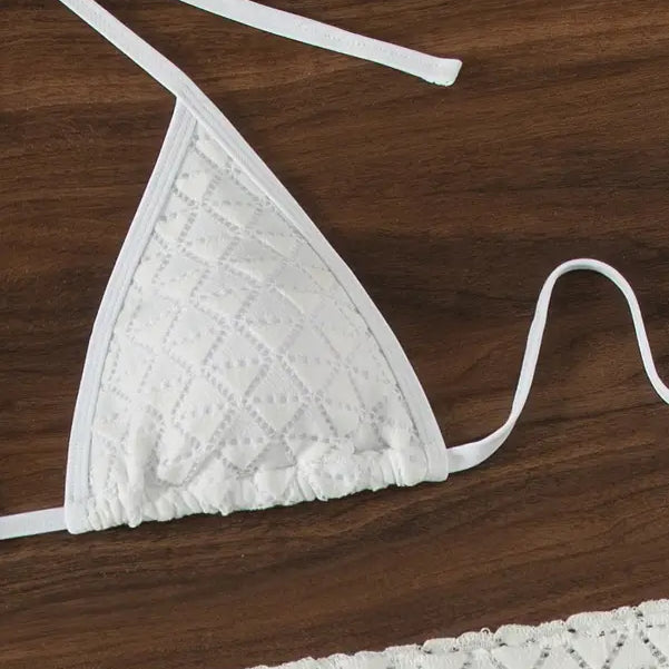 White crochet triangle bikini top with tie straps.