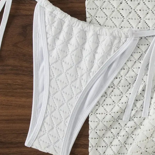 White bikini bottom with a quilted diamond pattern and tie sides.