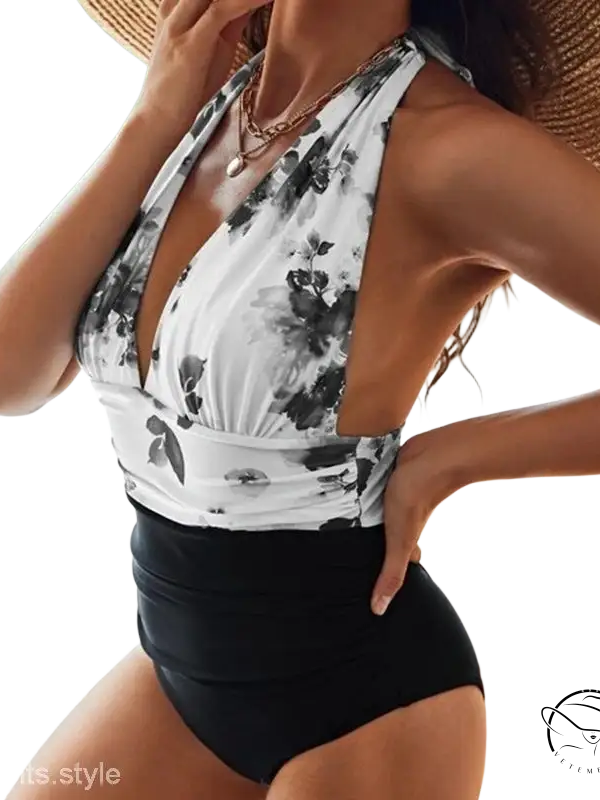 Stylish white tie-dye printing bikini with black floral halter-neck and high-waisted bottoms