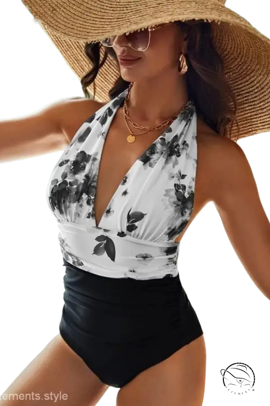 Stylish white tie-dye printing bikini with floral halter top and black ruched bottoms