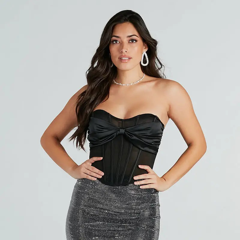 Woman wearing a black mesh sexy bandeau and sparkly skirt for summer fashion photoshoot
