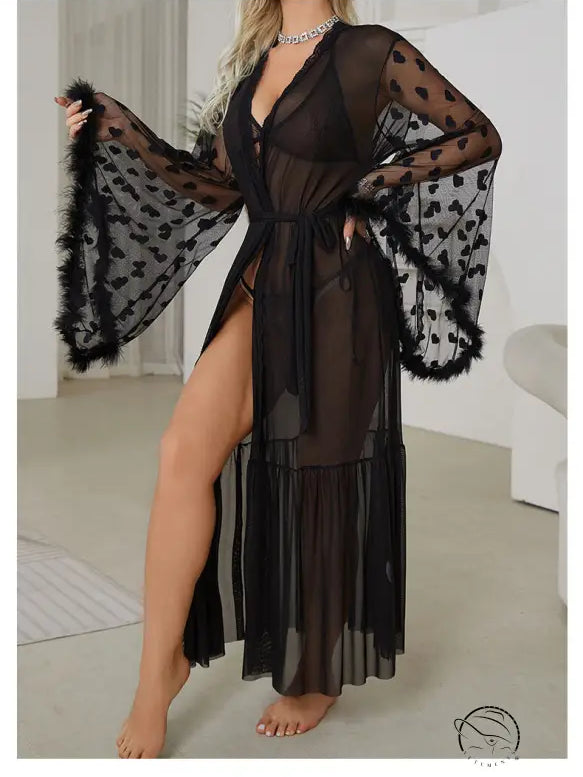 Sheer black robe with wide bell sleeves, heart patterns, and fur trim.