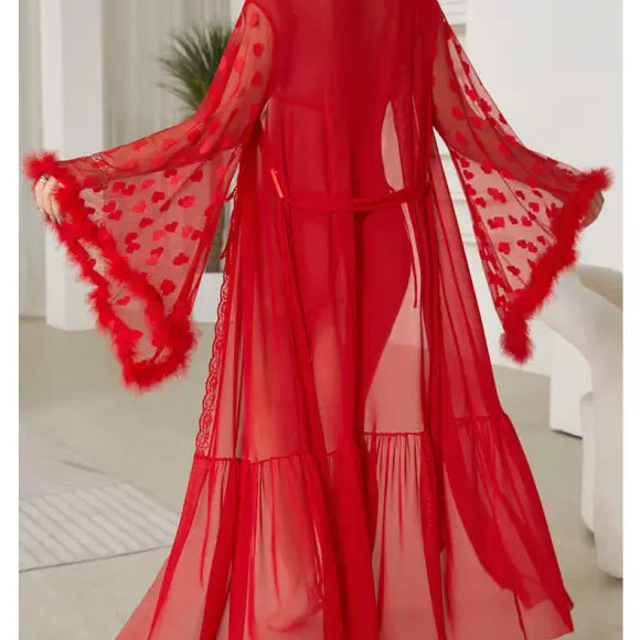 Vibrant red sheer robe with flared sleeves and feathered trim.