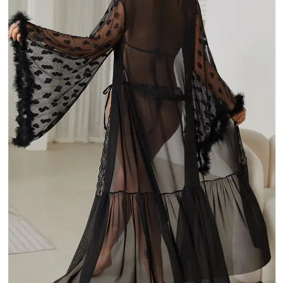 Sheer black robe with wide sleeves, polka dot pattern, and feathered trim.