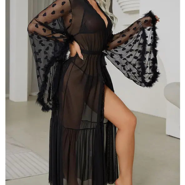 Sheer black robe with heart patterns and wide bell sleeves.