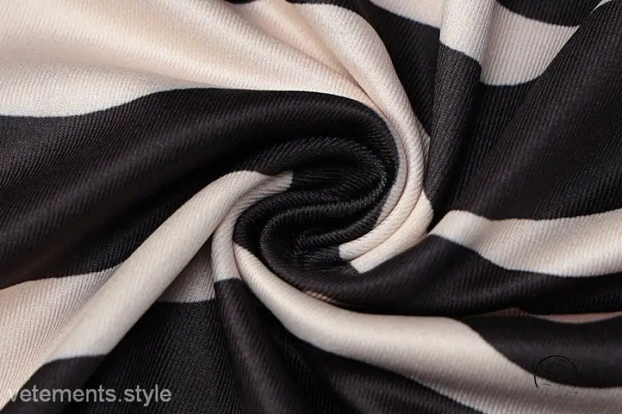 Brown zebra print backless sleeveless dress with twisted black and white striped fabric