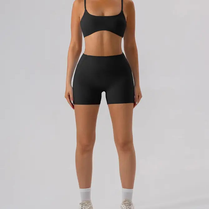 Black athletic bra and burnt tea brown close fitting yoga shorts set for activewear