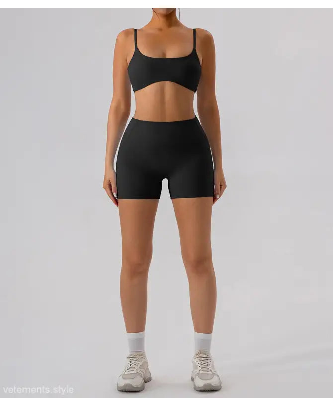 Black athletic bra and burnt tea brown close fitting yoga shorts set for activewear