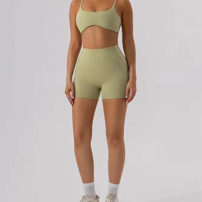 Woman in matching green athletic set featuring Burnt Tea Brown Close Fitting Yoga Shorts
