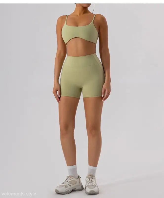 Woman in matching green athletic set featuring Burnt Tea Brown Close Fitting Yoga Shorts