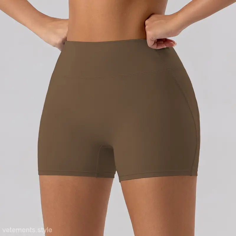 Brown high-waisted athletic shorts in Burnt Tea Brown, a stylish choice for yoga and fitness