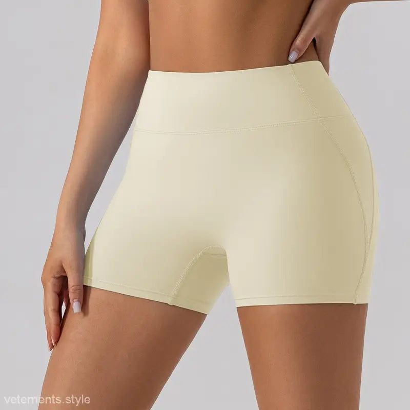 Cream-colored athletic shorts from the Burnt Tea Brown Close Fitting Yoga Shorts collection