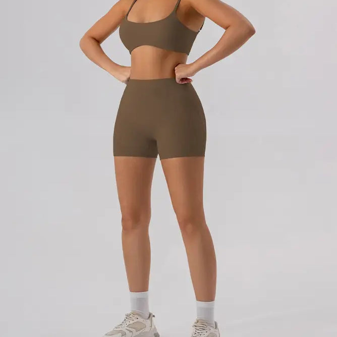 Woman in burnt tea brown athletic set featuring close-fitting yoga outer wear