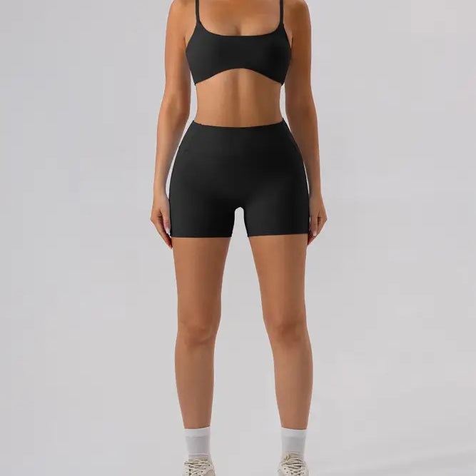 Black athletic bra and shorts set in Burnt Tea Brown close-fitting yoga outer wear
