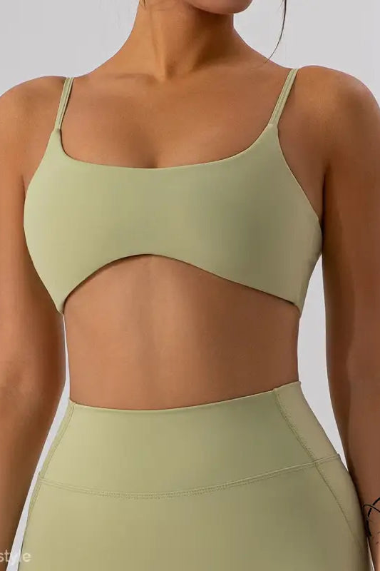 Burnt tea brown close fitting yoga outer wear sports bra with light green cutout