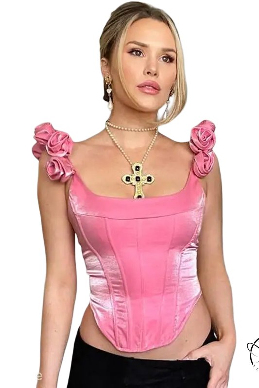 Woman in candy pink boning corset top slimming waist with rose embellishments
