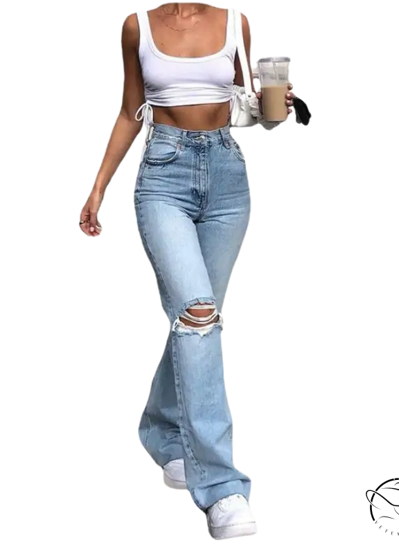 Woman in high waist retro stretch slim ripped jeans and crop top