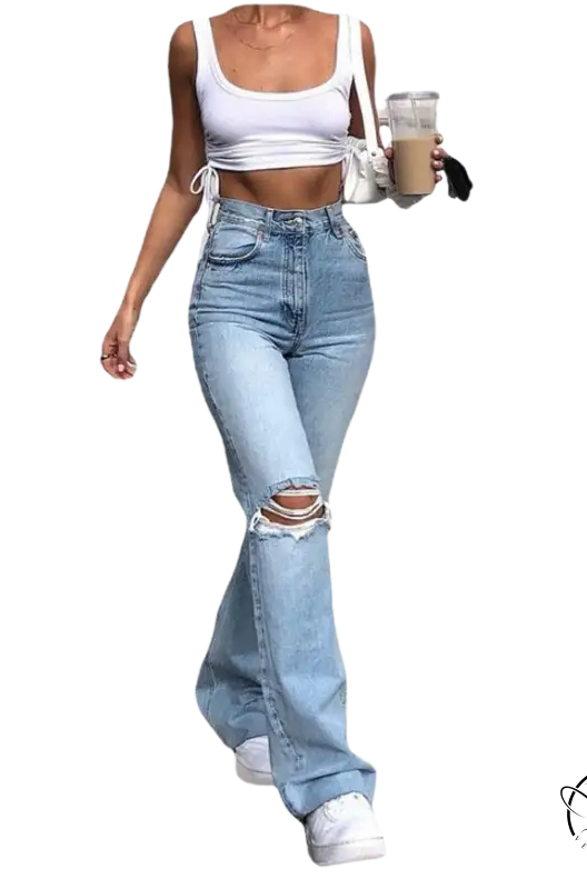 Woman in high waist retro stretch slim ripped jeans and crop top