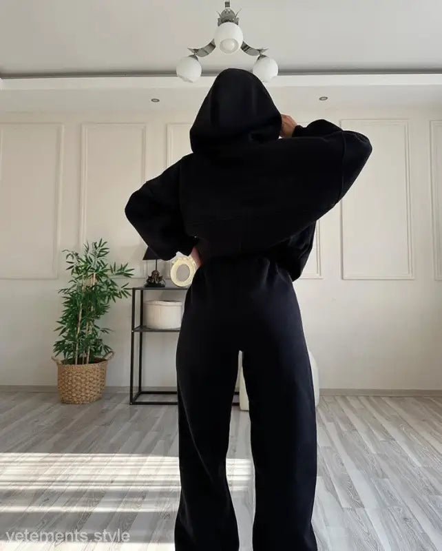 Person wearing all black casual comfy sweaters two piece winter solid color set from Casual Comfy Sweaters