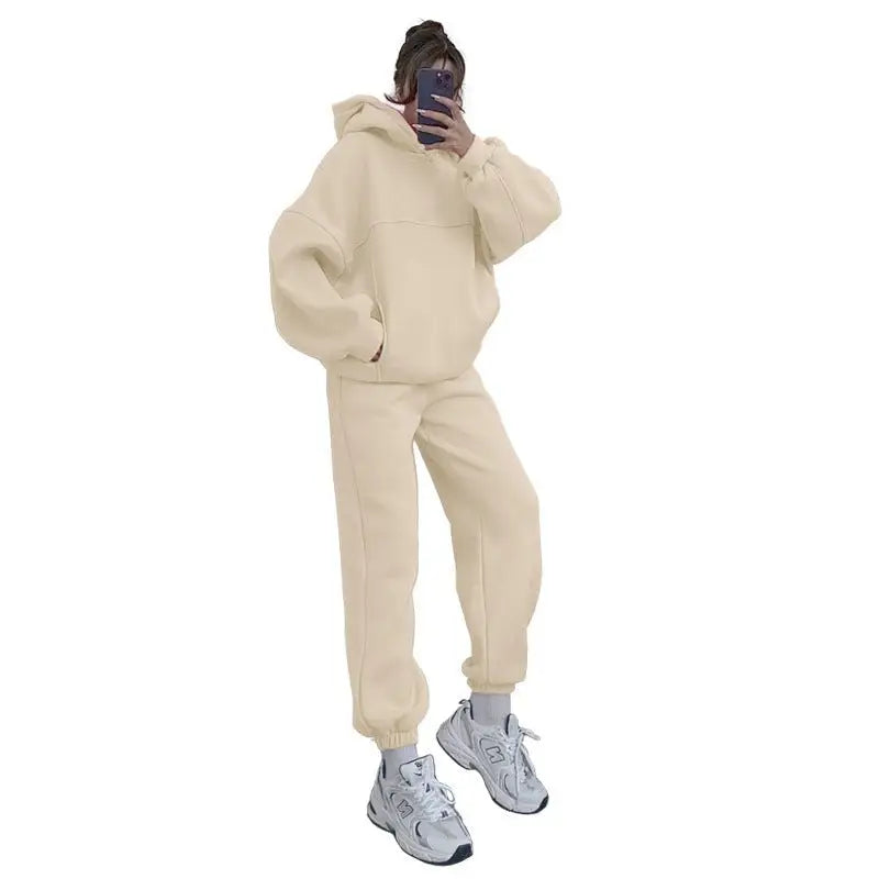 Person in casual comfy sweaters two piece winter solid color sweatsuit taking mirror selfie